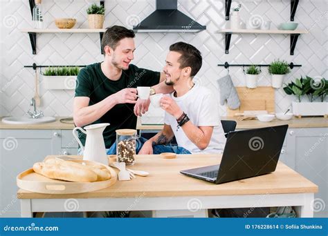 Happy Gay Couple Drinking Coffee And Having Fun Together Everyday Morning Routine Of Gay Couple