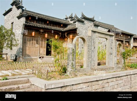 Old Traditional Style Chinese Brick House With Carved Eaves Stock Photo