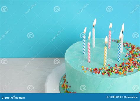 Fresh Delicious Birthday Cake With Candles On Table Against Color