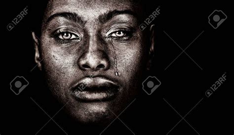 Very Strong Image Of An African Woman Crying Isolated On Black Black
