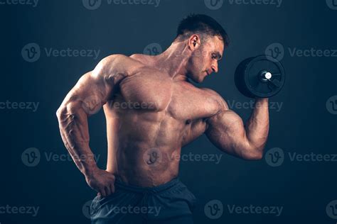 Muscle Man Doing Bicep Curls 949715 Stock Photo At Vecteezy