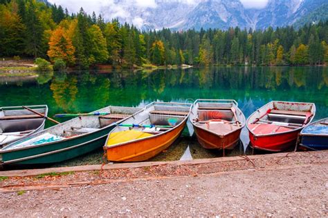 Lago Di Fusine The Mountain Lake At Boat And Mangart Mountain In The