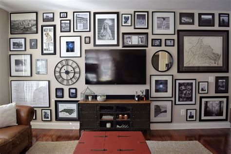 Black and white gallery wall that disguises the TV and fills the entire ...