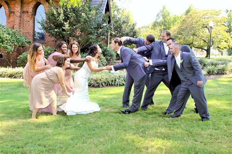 Bridal Party Pulling Bride And Groom Away Creative Wedding Photo