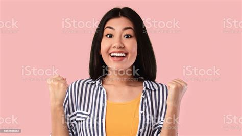Yes Portrait Of Emotional Asian Woman Screaming With Raised Fists Stock