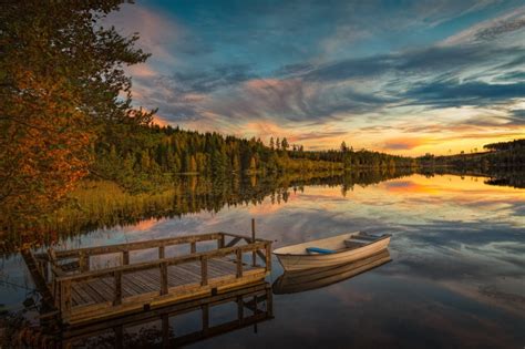 1369522 Sweden Autumn Marinas Rivers Forests Boats Sky Evening