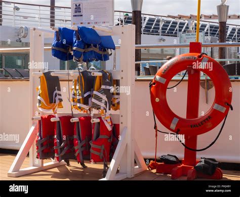 Life Ring And Life Jackets On A Cruise Ship Pool Deck Stock Photo Alamy