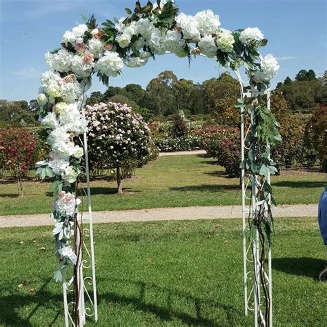 Metal Wedding Arch With White Flowers Ceremonies I Do