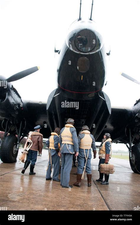 Air Crew With Avro Lancaster Ww2 Heavy Bomber On Airfield Stock Photo