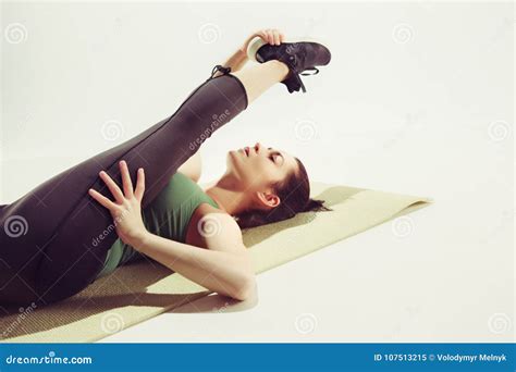 Beautiful Slim Brunette Doing Some Stretching Exercises In A Gym Stock Image Image Of Girl