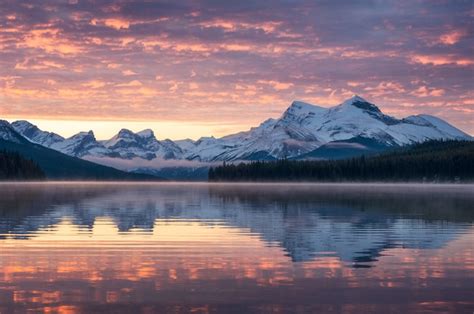 Premium Photo Canadian Rockies With Foggy Reflection On Maligne Lake