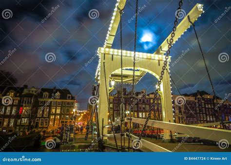 Old Dutch Bridge At Night Time Against Rush Clouds Editorial Photo