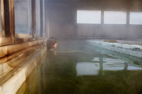 Woman Relaxing In Water At Japanese Spa And Hot Springs By Trinette