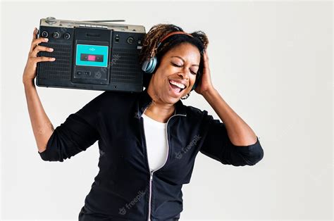 Premium Photo A Woman Listening To The Music From A Radio