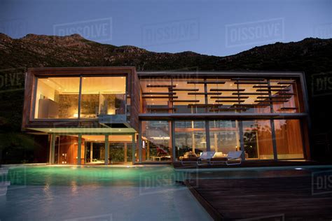 Illuminated Modern House At Night Stock Photo Dissolve