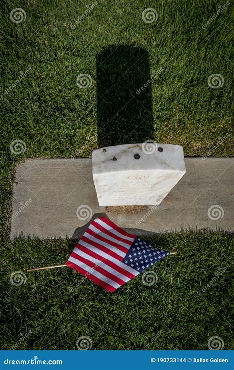 Military Grave Marker Decorated With American Flags Royalty Free Stock