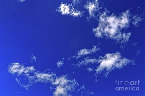 Fluffy White Clouds In A Deep Blue Sky Photograph By Kevin Richardson