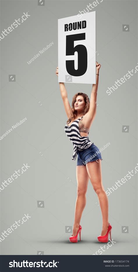 Boxing Ring Girl Holding A Board With Round Number High Resolution