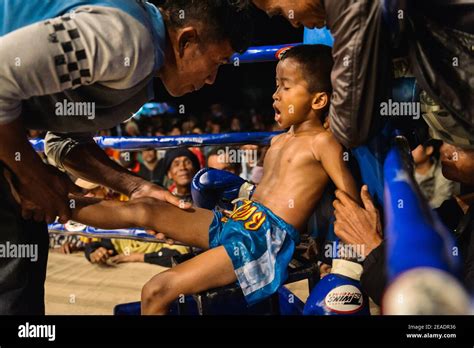 A Child Muay Thai Boxer Grasping For Air During Fight Stock Photo Alamy