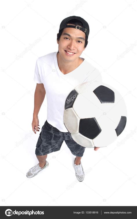 Man Holding Soccer Ball Stock Photo By ©microstockasia 133518916