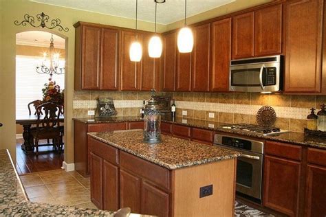 Use a bright countertop if you use a dark oak cabinet. new-venetian-gold-granite-with-honey-oak-cabinets-gallery ...
