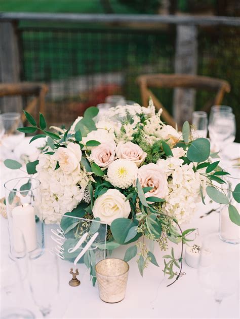 low centerpiece with roses dahlias hydrangea garden roses greenery blush and white