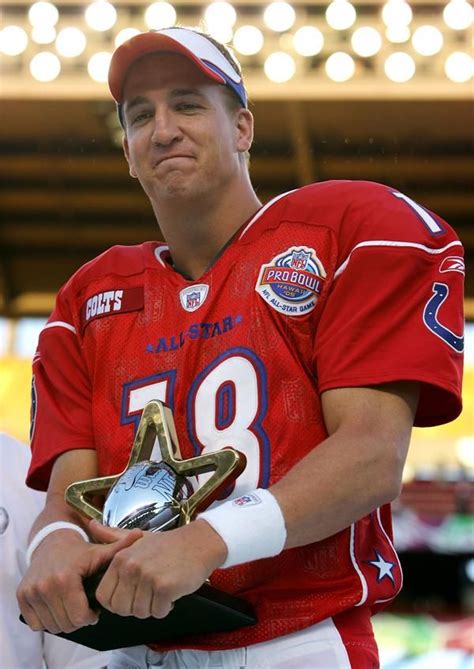Peyton Manning 18 Of The Afc Team Holds His Mvp Trophy After The Nfl