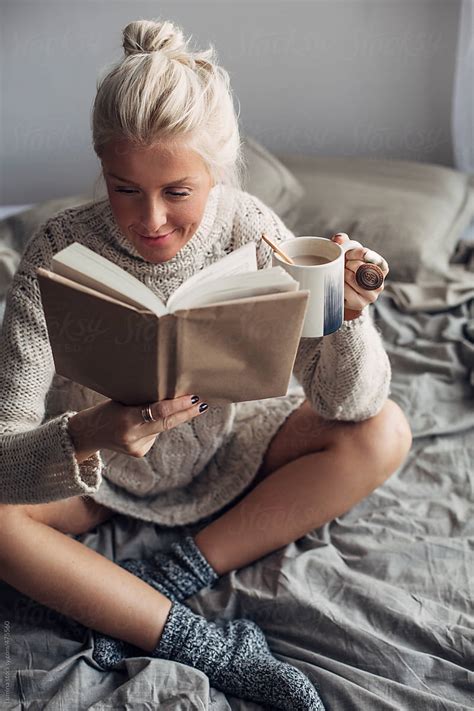 Happy Woman Reading A Book And Having Coffee In Bed By Stocksy Contributor Lumina Stocksy
