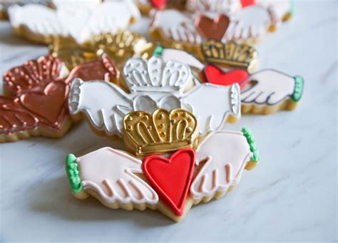 Forget the green food dye and add whiskey, baileys, and guinness instead. Claddagh Cookies, decorated nine ways! - Bake at 350°