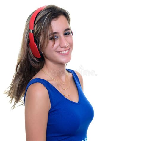 Adolescente Que Escucha La Música En Los Auriculares Inalámbricos Aislados Imagen De Archivo