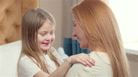 Cute Little Girl Hugging Her Mother With Her Eyes Closed Stock Video