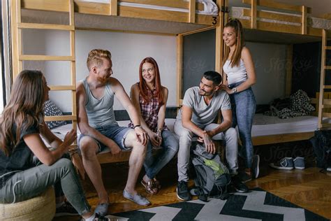 Young People Talking In Hostel Bedroom By Stocksy Contributor Mosuno Stocksy