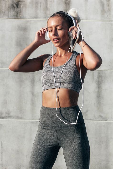 Outdoor Summer Sport Style Portrait Of Young Blonde Athlete Woman By