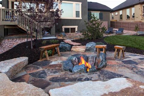 It seems to be separated from the rest of the world by a large stone retaining wall. 8 Outdoor Fire Pit Ideas for Your Backyard