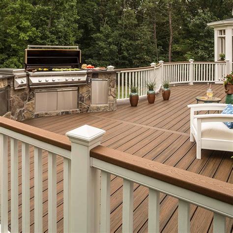 An Outdoor Kitchen And Grill On A Deck