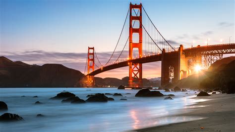 dawn at the golden gate bridge from baker beach san francisco california usa windows
