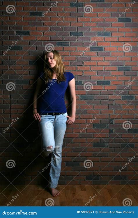 Woman Leaning Against Brick Wall Stock Image Image 5937871