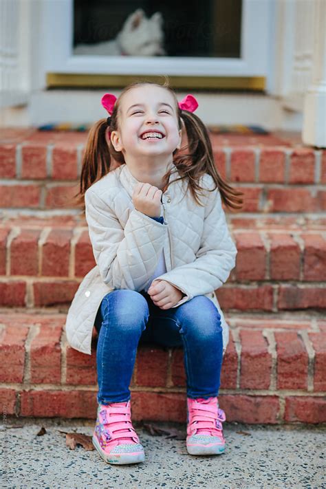 Cute Young Girl Laughing By Stocksy Contributor Jakob Lagerstedt Stocksy