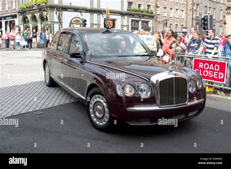 Queen Elizabeth Ii S Bentley Car Travelling Down The Royal Mile For An