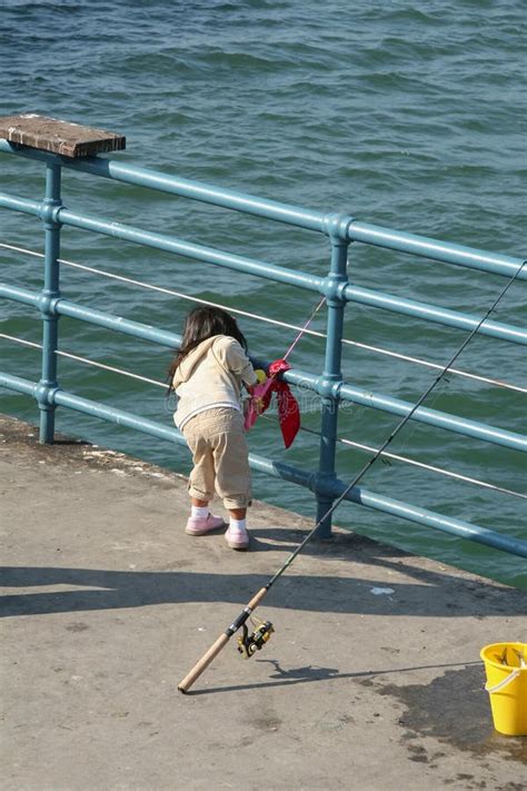 Girl Fishing On A Pier Editorial Stock Image Image Of Bait 101326749