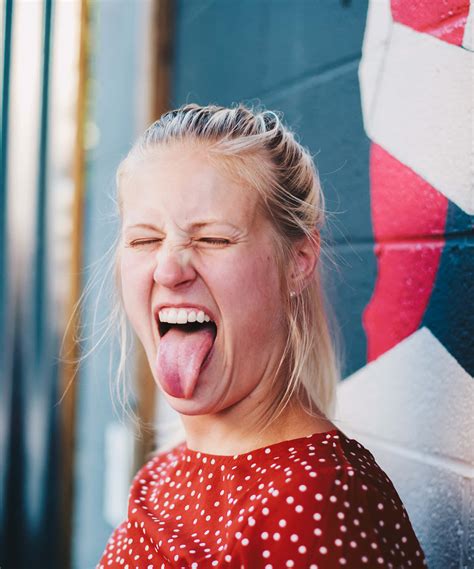 Download Funny Face Blonde Girl Sticking Tongue Out Picture