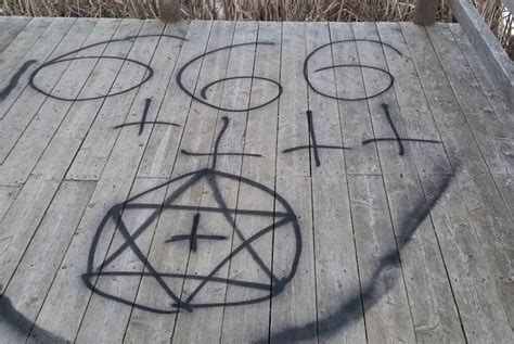 Vandals Damage Signs Spray Paint Satanic Graffiti In Sackvilles