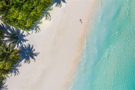Premium Photo Aerial View Of A Woman On The Beach In A Bikini Lying