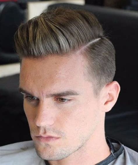 Low taper fade with hard side part. Hard Part Comb Over low fade haircut | MenHairstylist.com