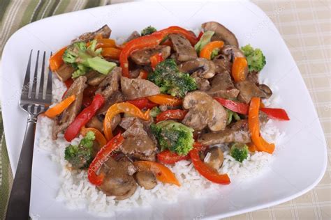 Continue to cook and stir until vegetables are tender, about 2 embellish this if you like with rice wine (as i did) or rice wine vinegar, oyster sauce, hoisin sauce or ginger. Beef Stir Fry on Rice — Stock Photo © chasbrutlag #30443077