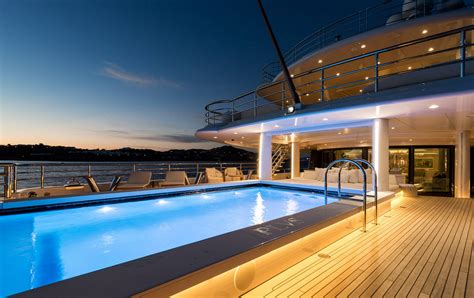 amels 242 pool in the evening copy — yacht charter and superyacht news