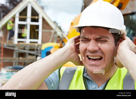 Construction Suffering From Noise Pollution On Building Site Stock
