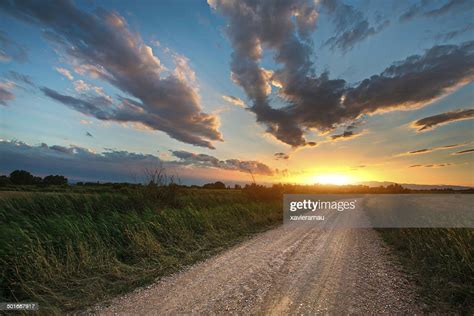 Beautiful Sunset On A Country Road High Res Stock Photo Getty Images