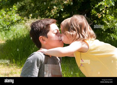 Little Girl Kissing A Boy Stock Photo Alamy