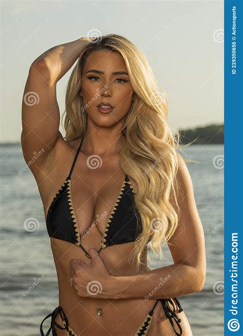 Lovely Blonde Bikini Model Posing Outdoors On A Caribbean Beach Stock Photo Image Of